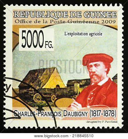 Moscow Russia - December 19 2017: A stamp printed in Guinea shows French artist Charles-Francois Daubigny (1817-1878) and his picture 