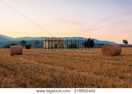 Hay bale at sunrise the Provence region in France