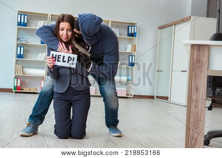 Criminal taking businesswoman as hostage in office