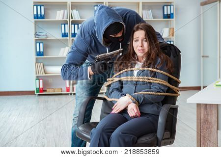 Criminal taking businesswoman as hostage in office