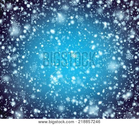 Night blue winter background with white snowflakes.