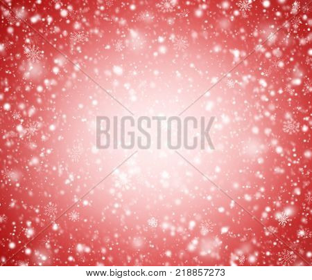 Red winter abstract background with snowflakes and light.
