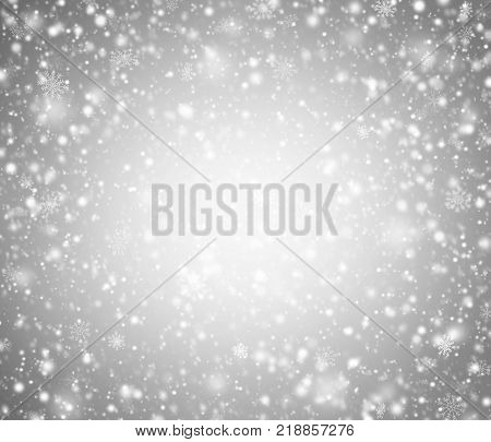 Light gray winter abstract background with snowflakes.
