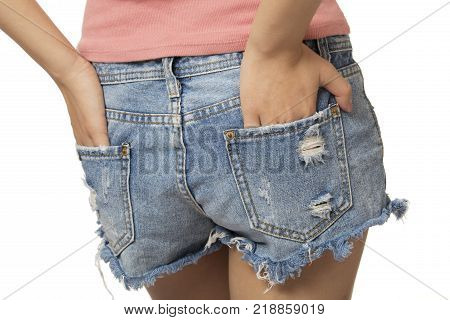 Sexy woman with her hands in her back pocket isolated on a white background