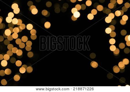 Abstract gold sparkle on black background. Christmas concept
