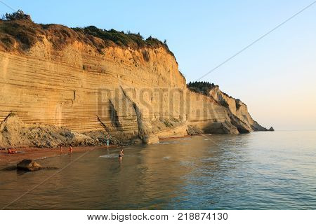 Rocks on the beach in the sunset on Corfu in Greece
