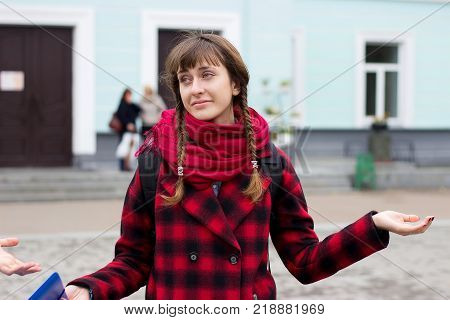 Closeup portrait of clueless young woman, student, worker arms out asking what's the problem who cares so what, I dont know. Negative human emotion facial expression