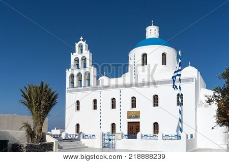 White blue orthodox church of Panagia Platsani, in the village of Oia. Santorini