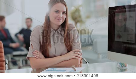 Young business woman  with her co-wokers in background at office