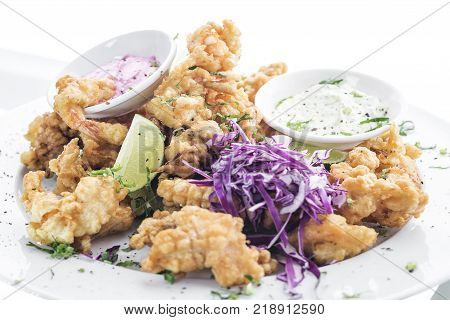 gourmet calamari tempura squid with tzatziki and pickled beetroot sauce meal