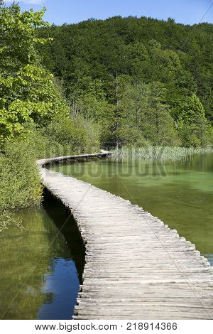 Landscape With Wooden Track Over The Water At  
