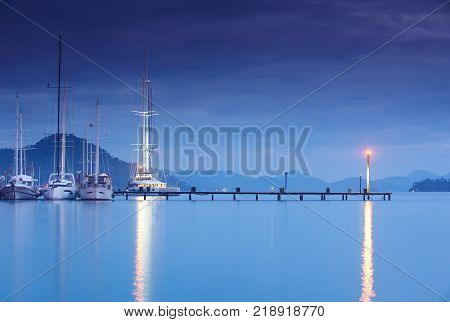 marina at night with moored yachts in Gocek Turkey