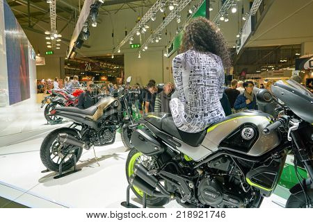 MILAN, ITALY - NOVEMBER 11, 2017: a model poses for the visitors during the EICMA 2017 - 75th International Motorcycle Exhibition.