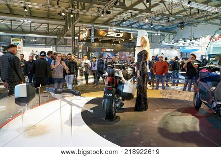 MILAN, ITALY - NOVEMBER 11, 2017: a model poses for the visitors during the EICMA 2017 - 75th International Motorcycle Exhibition.
