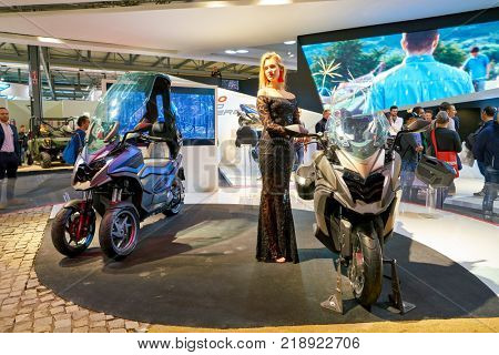 MILAN, ITALY - NOVEMBER 11, 2017: a model poses for the visitors during the EICMA 2017 - 75th International Motorcycle Exhibition.