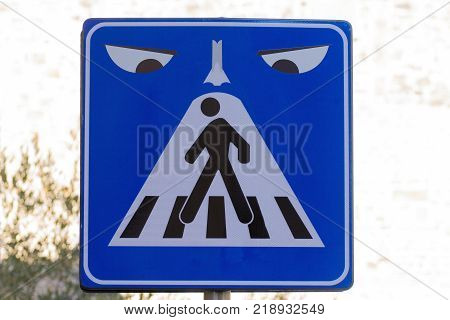 Road sign with eyes looking black man on the signal street art metropolitan