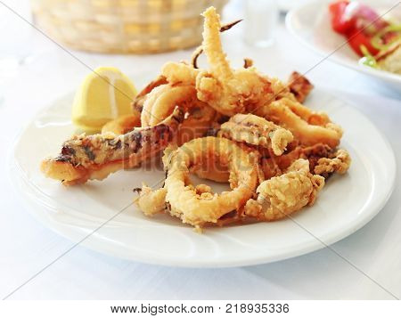 plate with squid at a greek tavern - mediterranean seafood