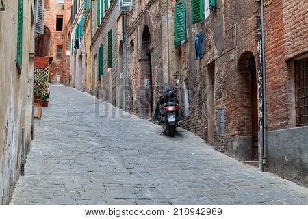 Siena charming narrow streets medieval town in Tuscany Italy
