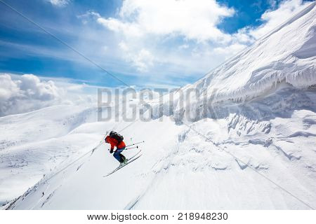 skier standing on top snow sunny day in Carpathian mountains Ukraine