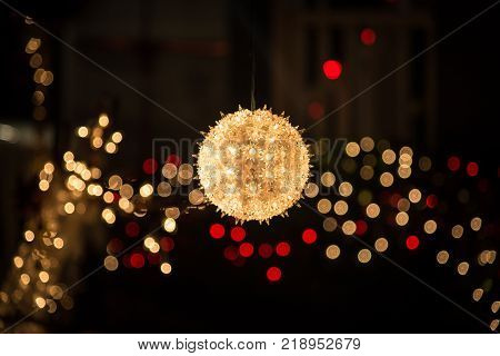 Yellow Christmas tree ball lighting in the night like a star