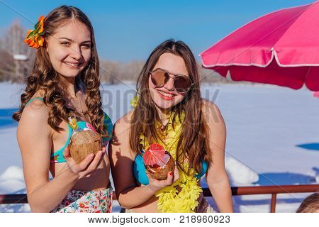Novokuznetsk, Kemerovo region, Russia - 23 Feb, 2017 : White beaches of Siberia is an enterteiment activity where people playing beach games dressed in bikini in winter. Women in bikini with cocktails