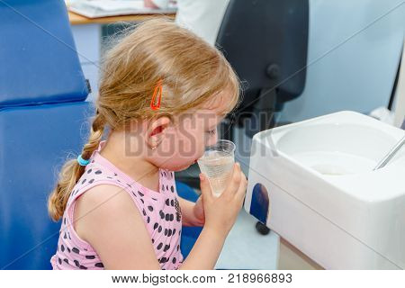 Portrait Of Sweet Little Girl With Glasses