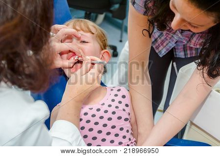 Portrait Of Sweet Little Girl With Glasses
