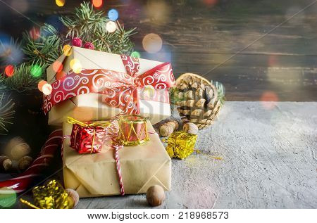 red Christmas background. black gift box balls fir branchesred Christmas decorations on the dark wooden background copy space