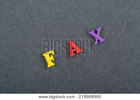 word on black board background composed from colorful abc alphabet block wooden letters, copy space for ad text. Learning english concept