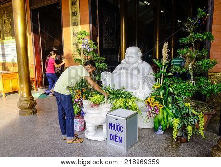 Long Xuyen Vietnam - Sep 1 2017. People praying at Chinese temple in Long Xuyen Vietnam. Long Xuyen is the provincial city and capital city of An Giang Province.