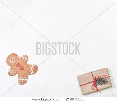 Christmas frame with gifts fir tree branches xmas holiday decorations festive symbols on white wooden background with copyspace. Christmas composition.