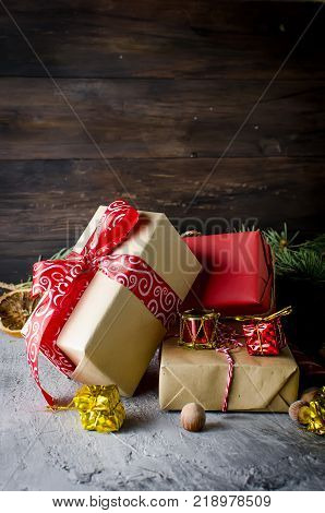 Red Christmas  Gift  Box With Red Ribbon And Fir Branches