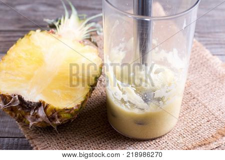 Pineapple puree in a blender on a table