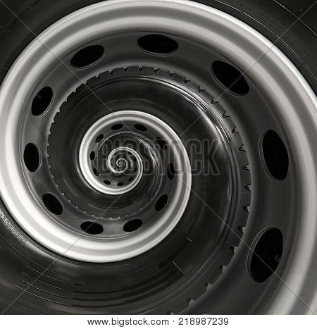 Car truck wheel abstract spiral fractal pattern background. Repetitive automobile automotive spiral background. Car wheel abstract pattern background. Truck wheel rim abstract spiral background