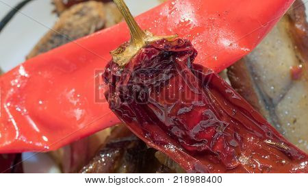 Chili red pepper in a white porcelan pot, hot chili pepper. Close-up, macro