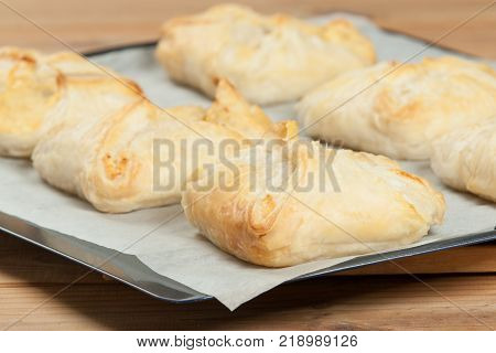 Homebaked Hungarian Cheese Puff Pastry Parcels. Iced Sugar