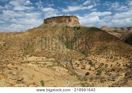 View to the rural surroundings and the hill, on top of which the famous 6-th century Ethiopian Debre Damo Monastery is located in Tigrai region, Ethiopia.