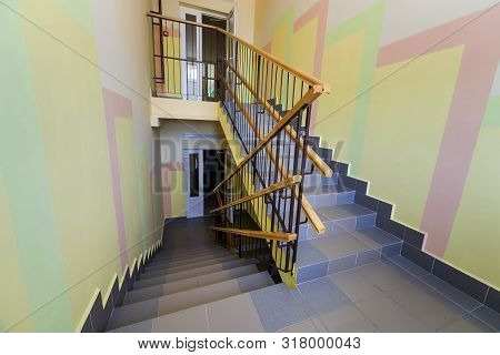 Wide Staicase Covered With Ceramic Tiles Indoors In A House Interior.