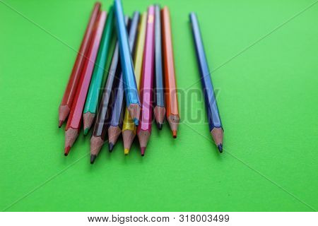 Drawings With Colored Pencils On A Green Background.many Colors.