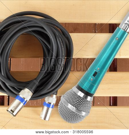 Music And Sound - Xlr Microphone Cable Professional And Microphone On A Wooden Background.