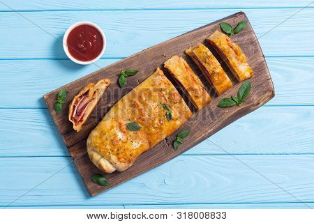 Pizza Roll Stromboli With Cheese Salami Olives And Tomatoes