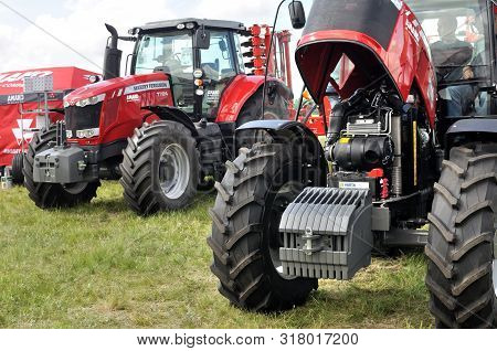Cherkasy, Ukraine - May 18, 2018: Modern Massey Ferguson Tractor Model 7724 With Modern Plough  Exhi