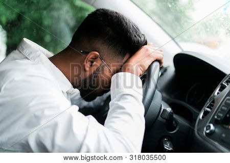 Drunk Man Slumped On Steering Wheel In His Car