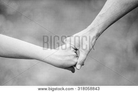 Help And Support. Father Hold His Child With Hand. Hands Together. Family Values And Love. Family Bo