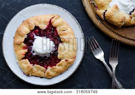 Homemade Cranberries Galette On Black Background. Open Pie, Cranberries Tart. Berry Bakery. Summer F