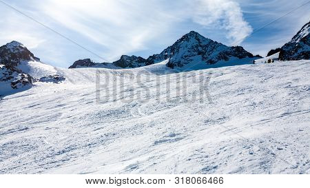 Stubai, Austria - November 1, 2011: Snowboarders And Skiers Riding On The Slopes Of The Stubaier Gle