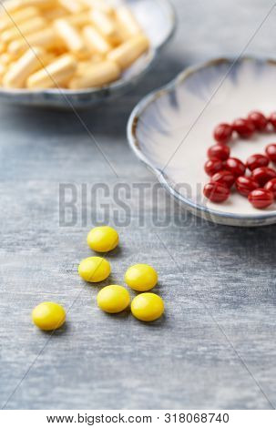Vitamin C, Beta-carotene Tablets And Coenzyme Q10 Capsules. Antioxidants. Concept For A Healthy Diet