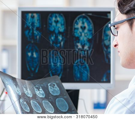 Doctor radiologist looking at x-ray images