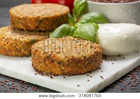 Tasty Vegetarian Burgers Made From Healthy Quinoa, Basil, Tomatoes And Mozzarella Cheese