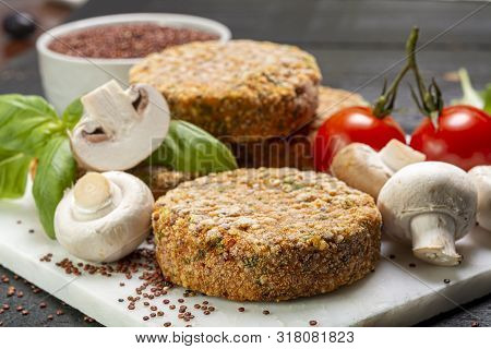 Tasty Vegetarian And Vegan Burgers Made From Healthy Quinoa, Basil, Tomatoes And Champignon Mushroom